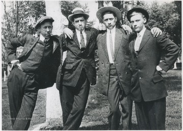 The four are pictured at Courthouse Square. 