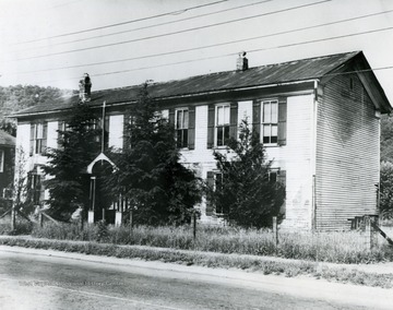 Avis School in Hinton, West Virginia in Summers County was torn down in the Summer of 1956 after this picture was taken. Building was constructed in 1891.