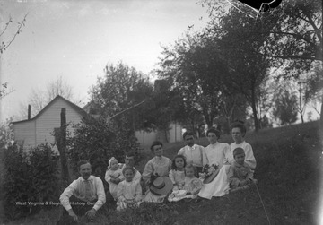 Photographer, James Green sitting on the right, ("after the Panic of 1907"); Front row: to James Sr.'s right is Virginia, to the far left is James Green Jr., Back row: the 2nd woman left might be Edith Green (photographer's wife).