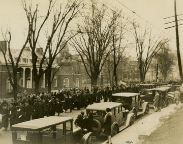 Note on back of photograph reads: "Part of academic procession marching to Field House at West Virginia University, where Dr. John R. Turner was inaugurated on November 1928 as the State University's tenth president."