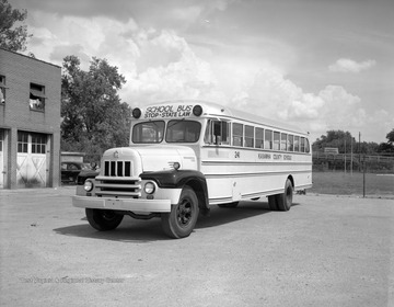 "J.D. Moore Company Belle School Buses."