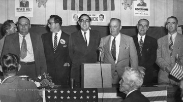 Rush Holt stands with other candidates during a campaign rally.