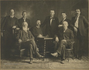 From left to right: Harrison Gwinn (President), J. H. Jordan (Cashier), C. B. Mahon (Vice President), N. Read, Harvey Ewart, Judge Miller, Mr. Drumheller, and Mr. Brightwell.