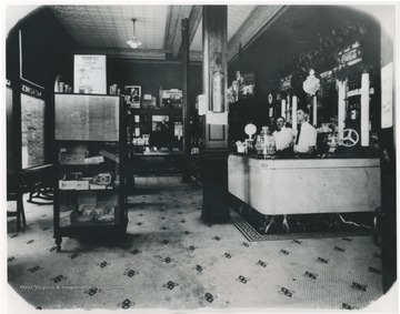 Mr. Welfrey, left, and Leo Poteet, right, stand behind the counter of the store located inside the McCreery Hotel.