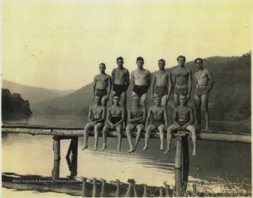 The unidentified men of the Civilians Conservation Corps pose by the swimming hole off the banks of New River. 