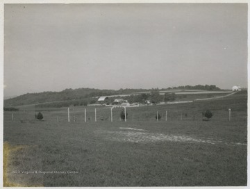 The farm house and grounds pictured in the distance.