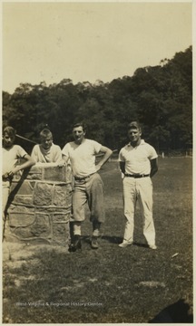 Garrity, pictured third from left, poses with three unidentified campers. The camp later became "Camp Summers" in 1985.