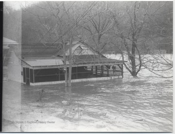 A house is surrounded by the flood waters on all sides. 