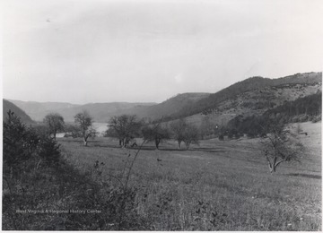 The river is pictured in the distance across the valley. 