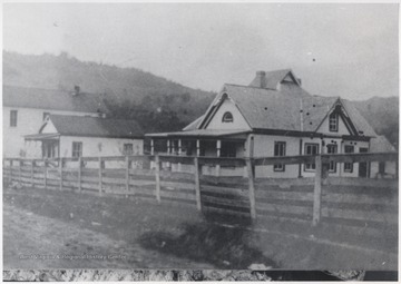 Home built by Dr. Ryan. Small building in the background is Dr. Trail's office. Behind the office is A. T. Whitlock Store, which closed later in the 1930's. 