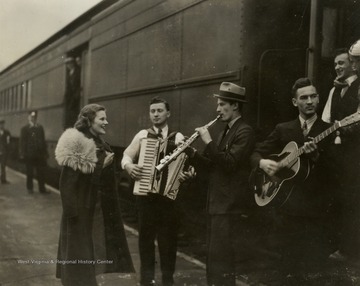 Group of musicians are likely members of the Rhythm Rangers, performers on the "It's Wheeling Steel" radio broadcast. This broadcast began in 1936 as a way to promote both Wheeling Steel Corporation's products and their employees who exclusively ran and performed on the broadcasts.