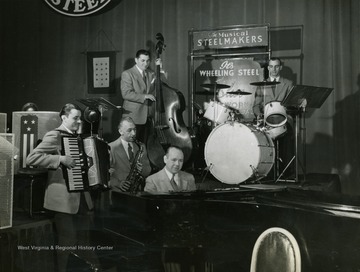 Caption on back of photograph reads: "Here's the same quintet on Sunday, running over a number before air time. Lew Davies is the conductor of the program's 23 piece orchestra of mill, plant, and office workers."