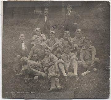Standing in the back to the left is Mike Mahanes.  Next to him is Lee Barnette.Sitting in the back row next to an unidentified suited man is Bob Callaham, followed by Herbert Swats, Frank Garrison, and unkown.In the middle row, sitting next to the suited man, is Herndon Callaham. 