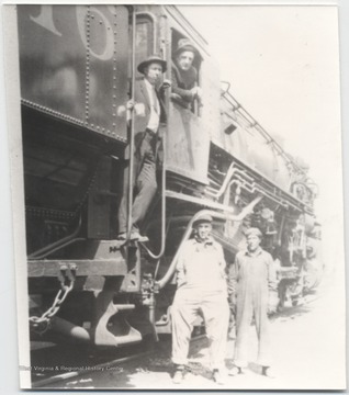 Donald Brightwell pictured on the steps of the train. Mr. McClean is in the window. Standing on the ground beside the train is A. F. Pete Sentz and Fred Worles. 