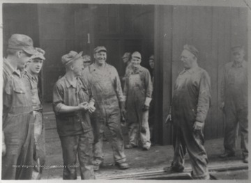 Pictured, from left to right, is John McLaughlin (machine helper), Arnold Lilly (machinist), Bernard Richmond (machinist), Joe Allen (machine helper), B. J. Edwards (pipe fitter), Bill Linkerhoker (machinist) and Bill Williams (machine helper).