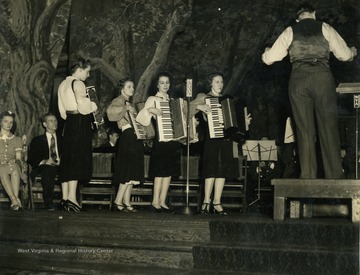 Caption accompanying photograph reads: "Something unique for any broadcast is an accordion quartet of young ladies. The first is Nancy Row, granddaughter of a founder of Wheeling Corrugating, next is a young lady who, together with her brother is employed at Yorkville. Third's father was employed by the corporation. Fourth is a teacher."