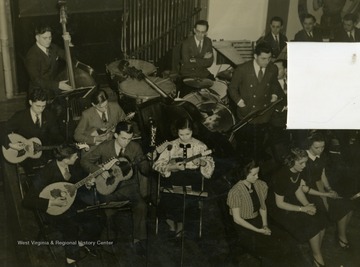 Caption accompanying photograph reads: "The Croatian Tambouritza Orchestra numbers six youthful members, two of whom work for the corporation, the remaining four being children of mill employees." Like all who worked for the broadcast, it was required to be an employee of Wheeling Steel or an immediate family member of an employee.