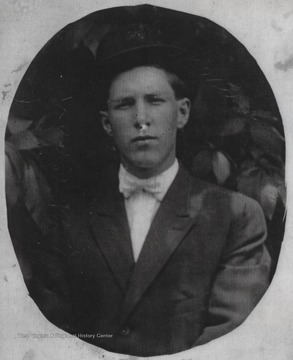 Houston, son of Manderville Cook and Sally Goff Cook, is pictured in a suit.