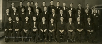 Caption accompanying photograph reads: "Here is the Portsmouth Works Male chorus who headline on the family broadcast now from their home town. Organized about the time the family broadcast started, interest has increased due to the opportunity of a nation wide outlet for their talent."