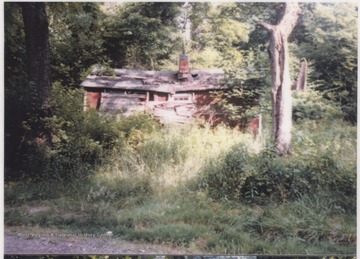 View of the old, boarded-up home located on Leatherwood Road.