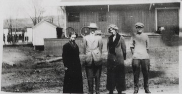 Renj Jones, Harold Brightwell, Edith Perry, and Bill Ford pictured outside the building.