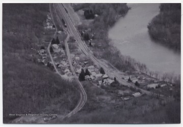 An aerial view of the town located next to the river. 