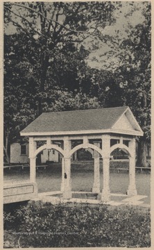 View of the awning that sits over a spring running through the grounds.