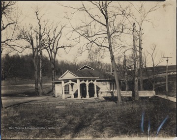 View of the building from across the stream and lawn. Here, spring water was bottled.