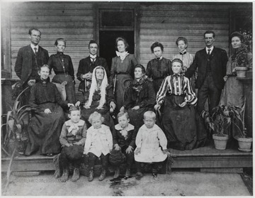 Second from left in the back is Martha E. Charleton Bigony and to the right of her is Dr. John F. Bigony.Sitting, from left to right, is Sarah Jane Wilson Charleton, Nancy Pinkley Wilson, unidentified, and Mrs. Hinton.Sitting in the front row, from left to right, is Dr. John Charleton Bigony, Paul Ellesworth Bigony, Joseph Clair Bigony, and Dorsy Madison.