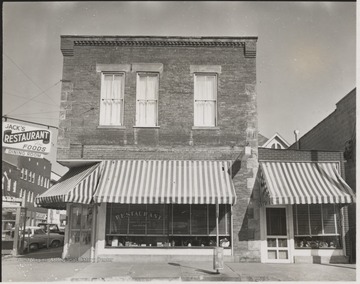 Photo of the building located on the corner of Second Avenue and Temple Street.