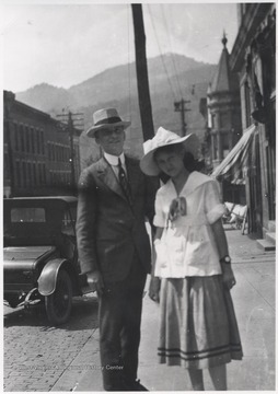 The unidentified man and unidentified woman are pictured on the sidewalk. 