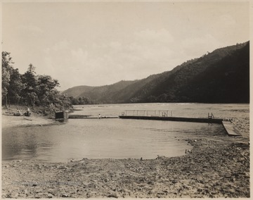 Two unidentified boys sit on the dock located in the Bluestone Reservoir.