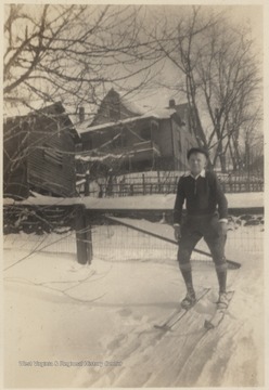 Neely pictured wearing skis on the snow-covered ground. 