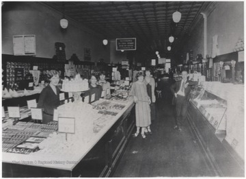 Employees pose inside the shop located on Temple Street.