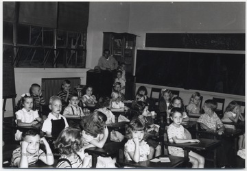 School children sit in their desks. Subjects unidentified. 