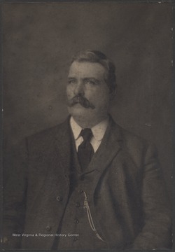 Willey pictured in a photo studio wearing a suit.