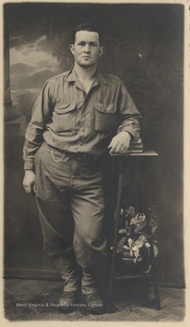 Lemon, a World War I soldier, is pictured in front of a photo studio background. 