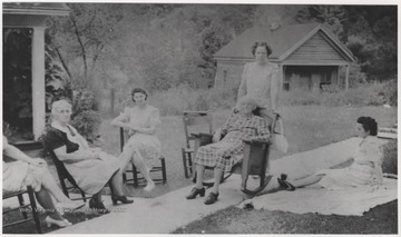 Pictuerd from left to right is Jessie Lois, Ada Neely, Trusby Neely, Grandmother Clara Meador Lilly, unidentified, and Aunt Gussie. 