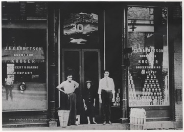 Located at 304 3rd Avenue, Clyde Harford (right) and associates stand outside of the first ever Kroger Grocery & Baking Company store to enter the city. J. E. Garrettson served as the store's manager. The store later became Bowlings Dairy Bar.
