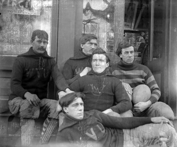 West Virginia University 1896 Football team members Yost, Krebs, White and Yeager sit in front of Donley's Cigar store in the Fall of 1896.