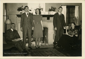 Portrait of Maryat Lee and her family at Christmas. Pictured left to right are her father, Dewitt Collins Lee, her brother Robert E. "Buzz" Lee holding hands with Maryat, and her oldest brother John Lee holding hands with her mother Grace Dyer Lee.Maryat Lee (born Mary Attaway Lee; May 26, 1923 – September 18, 1989) was an American playwright and theatre director who made important contributions to post-World War II avant-garde theatre.  She pioneered street theatre in Harlem, and later founded EcoTheater in West Virginia, a community based theater project.Early in her career, Lee wrote and produced plays in New York City, including the street play “DOPE!”  While in New York she also formed the Soul and Latin Theater (SALT), and wrote plays centered around the lives of the actors in the group.In 1970 Lee moved to West Virginia and formed the community theater group EcoTheater in 1975.  Beginning with local teenagers from the Governor’s Summer Youth Program, the rural theater group grew, and produced plays based on oral histories collected from the local community.  Each performance of an EcoTheater play involved audience participation and discussion.  With the assistance of the Humanities Foundation of West Virginia, guest scholars became a part of EcoTheater.