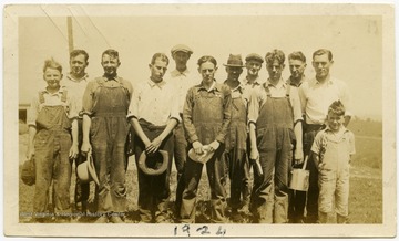 Crew members of the WVU Agriculture school Dairy Farm pose for a portrait.