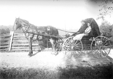 Page and his wife are pictured in a buggy, likely in West Virginia. 
