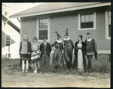 Unidentified group of people pose for photo in their masquerade costumes in the town of Nitro, W. Va..