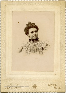 Portrait of Nancy Lauck from a photograph album of late nineteenth century images featuring residents from Keyser, W. Va.  "Mrs. Wm. MacDonald, Nancy J. Lauck, married Wm. MacDonald Attorney at Law, Keyser, W. Va."