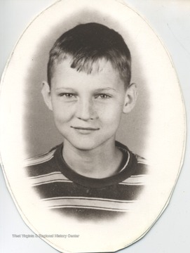 West is pictured at 7 years old, likely when he was living in Chelyan, W. Va. 