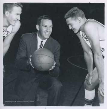 West, right, is pictured with Willie Akers, left, and Coach Fred Schaus, center. West played for West Virginia University's basketball team from 1956-1960, before he was drafted by the Los Angeles Lakers. 