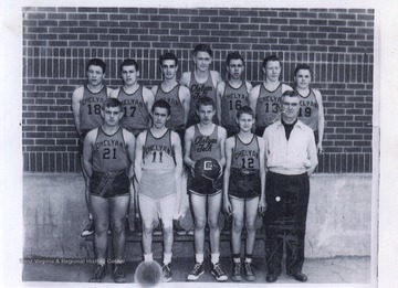 Jerry West is Number 12 in the front row, second from the right. He played as the team's starting small forward. 