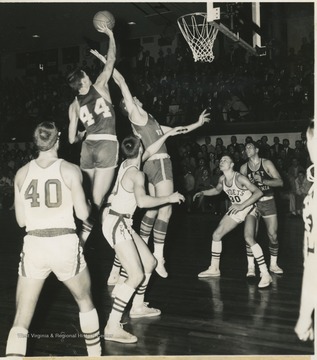 West (No. 44) is pictured midair as he prepares to shoot two of his overall thirty-nine points at the game against VMI. The Mountaineers won with a 101-71 victory. 