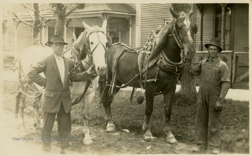 Two men pose with their horses likely in Tucker County, W. Va.This image is part of the Thompson Family of Canaan Valley Collection. The Thompson family played a large role in the timber industry of Tucker County during the 1800s, and later prospered int he region as farmers, business owners, and prominent members of the Canaan Valley community. 